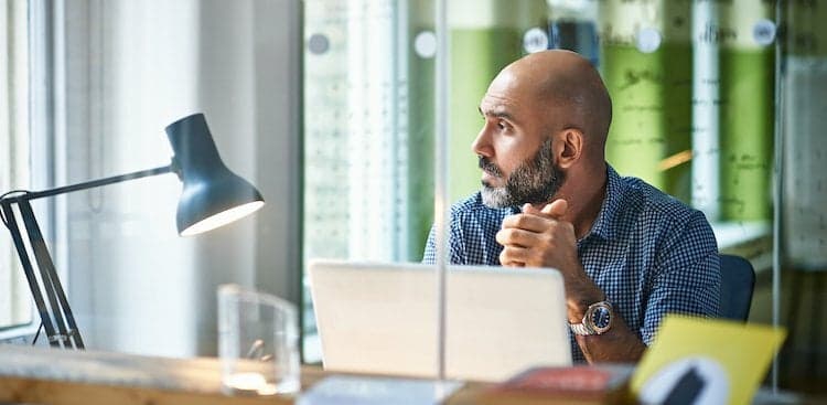 person thinking at desk